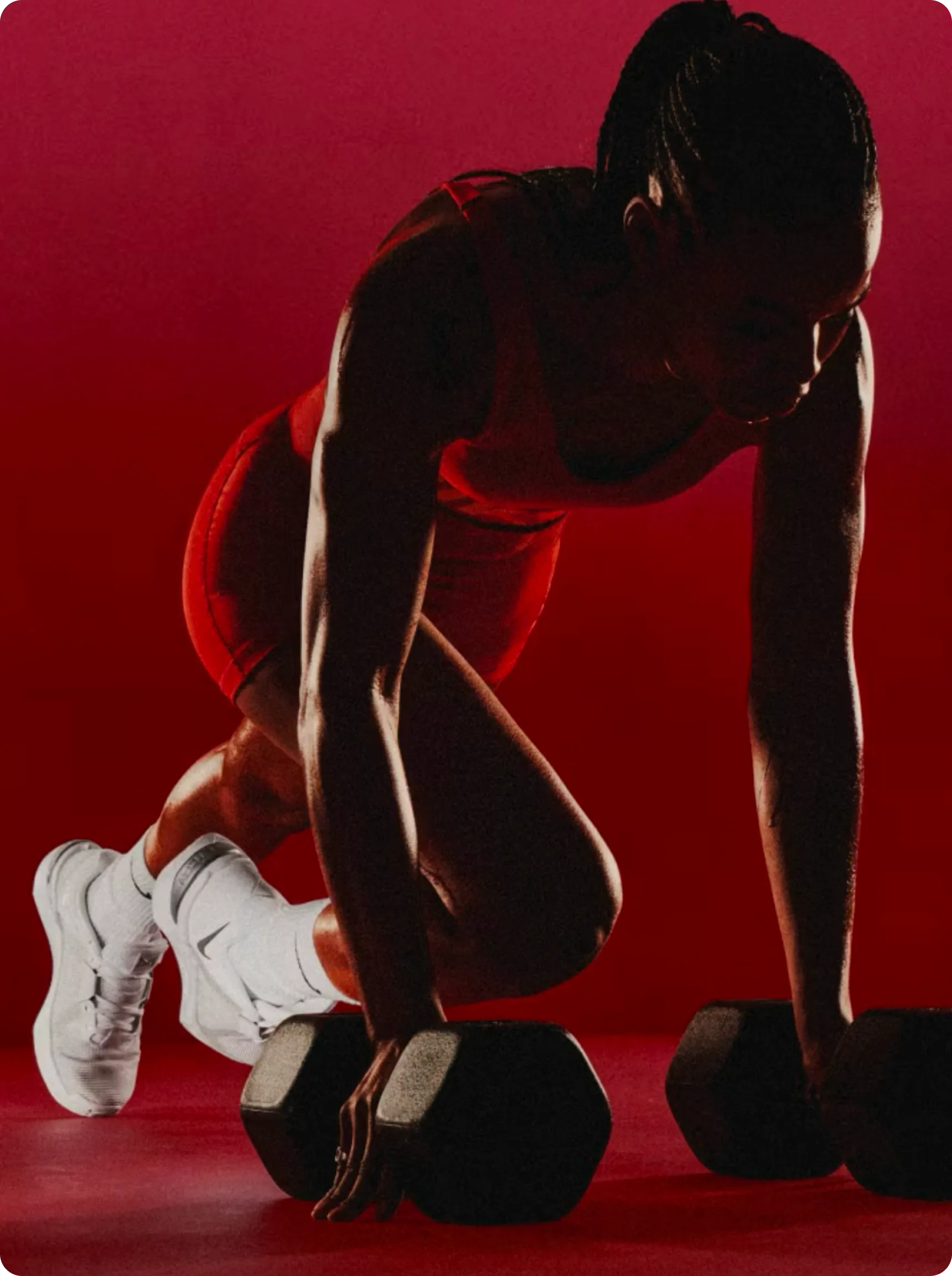 Transition — athlete with dumbbells, red lighting
