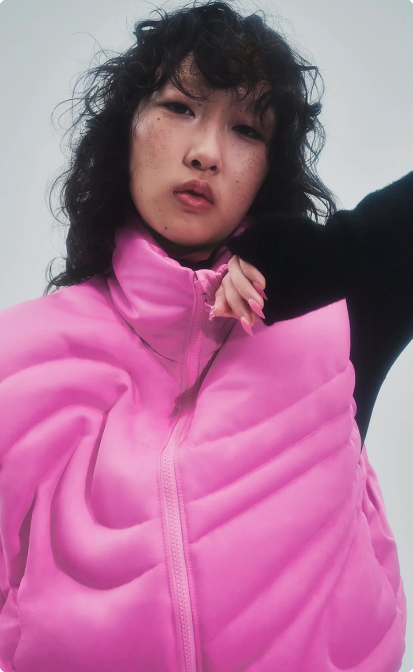 Nike Swoosh Puffer Campaign — model in pink puffer jacket
